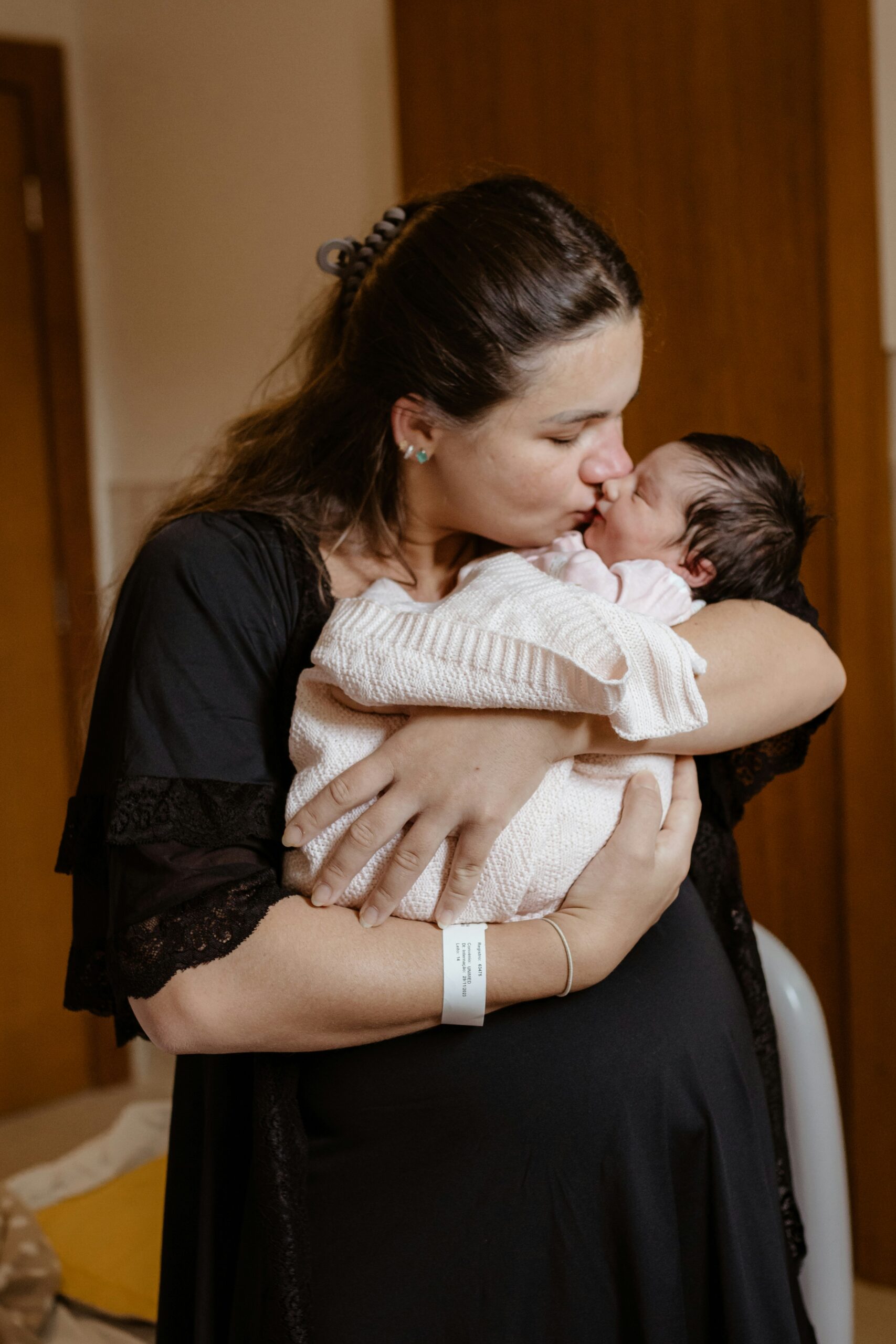 Caregiver holding a newborn close